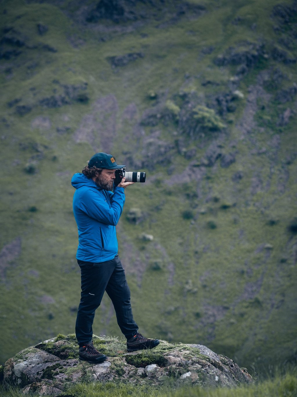 a photo of mike brogden taking photos on a mountain
