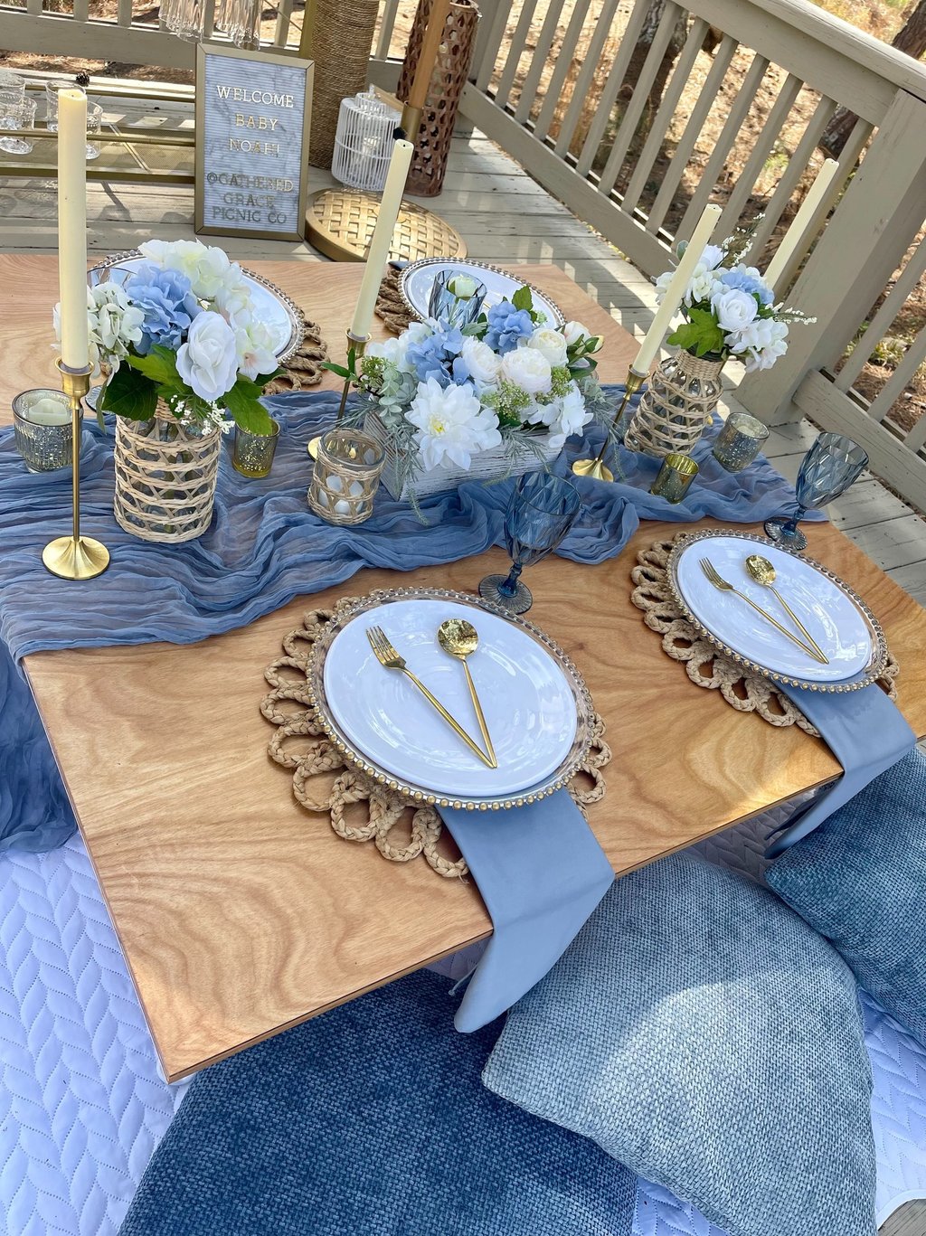 Outdoor elevated picnic in soft blue tones with elegant table styling Monroe, GA occasions & events