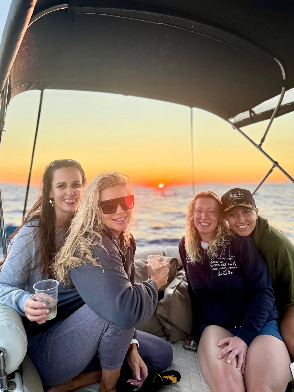 Girls enjoying and smiling at private Sunset Tour Experience on the Adriatic Sea near Split, Croatia