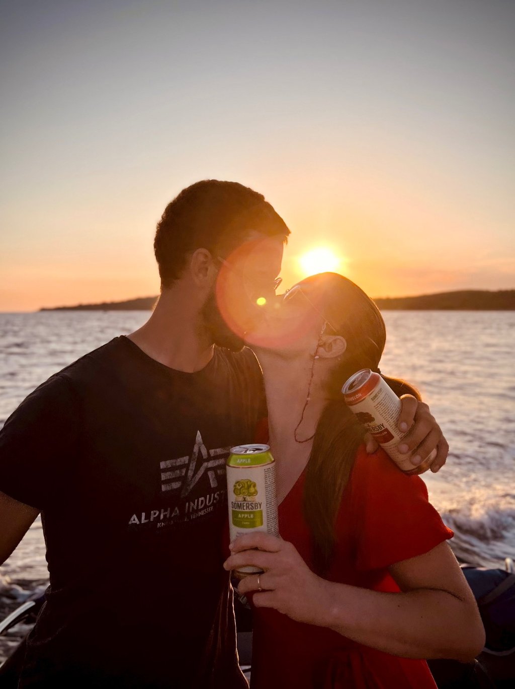 A couple is kissing in Split Croatia during romantic Sunset Boat Tour