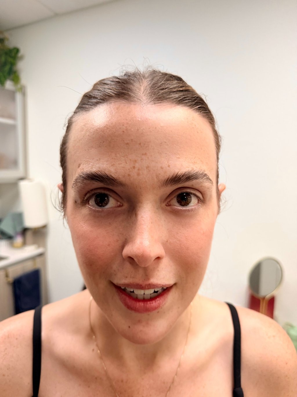 Natural lashes before extensions, forward-set green eyes
