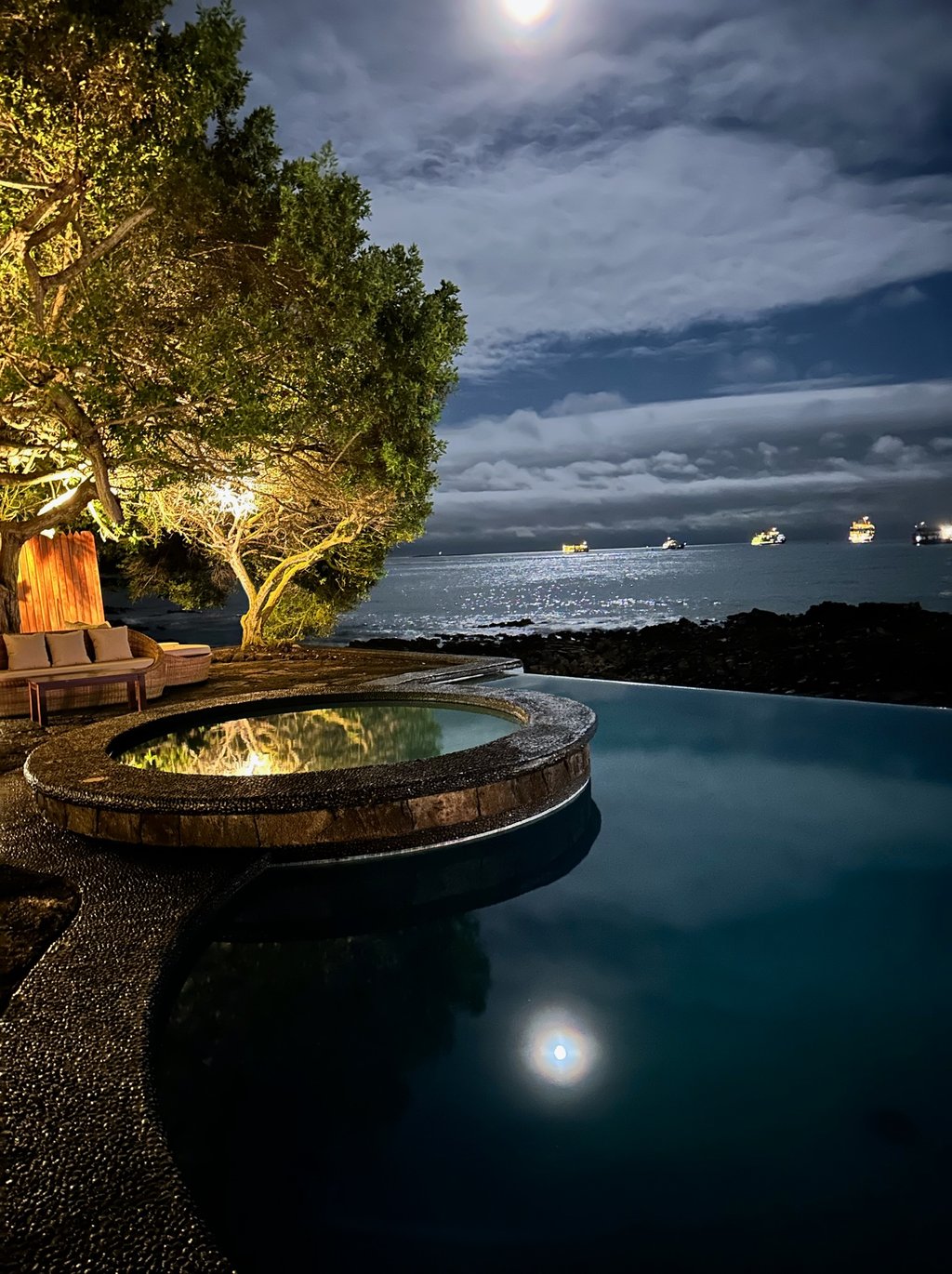 Outdoor pool area at Villa Escalesia Galapagos, offering a relaxation space within a refi