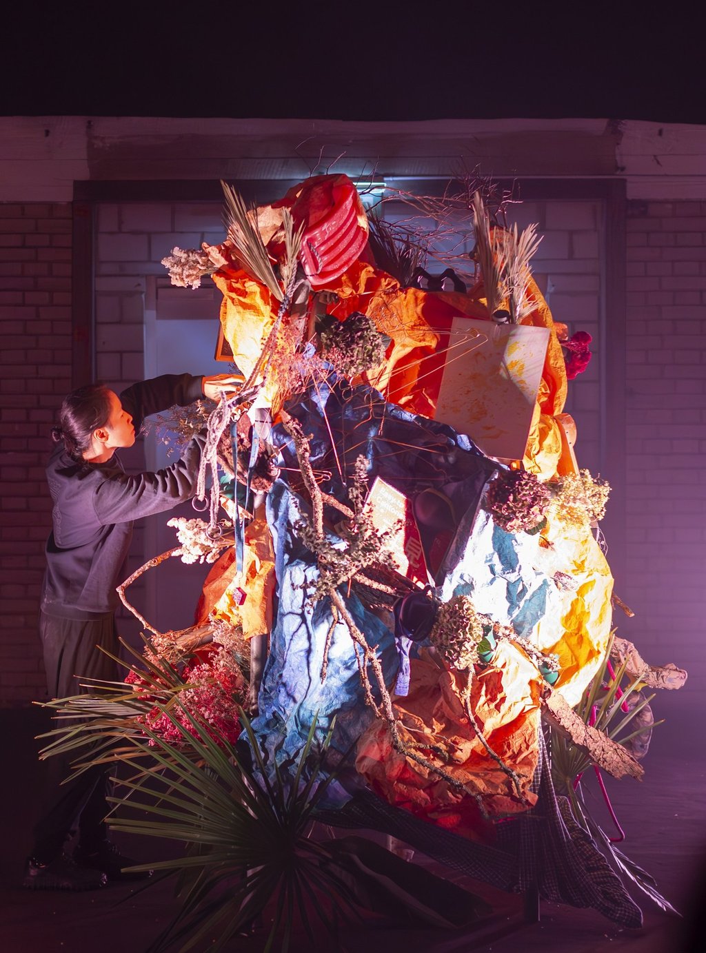 Community-collected objects in 'Menhir Tapestry 1' ikebana performance, PF25 cultural projects
