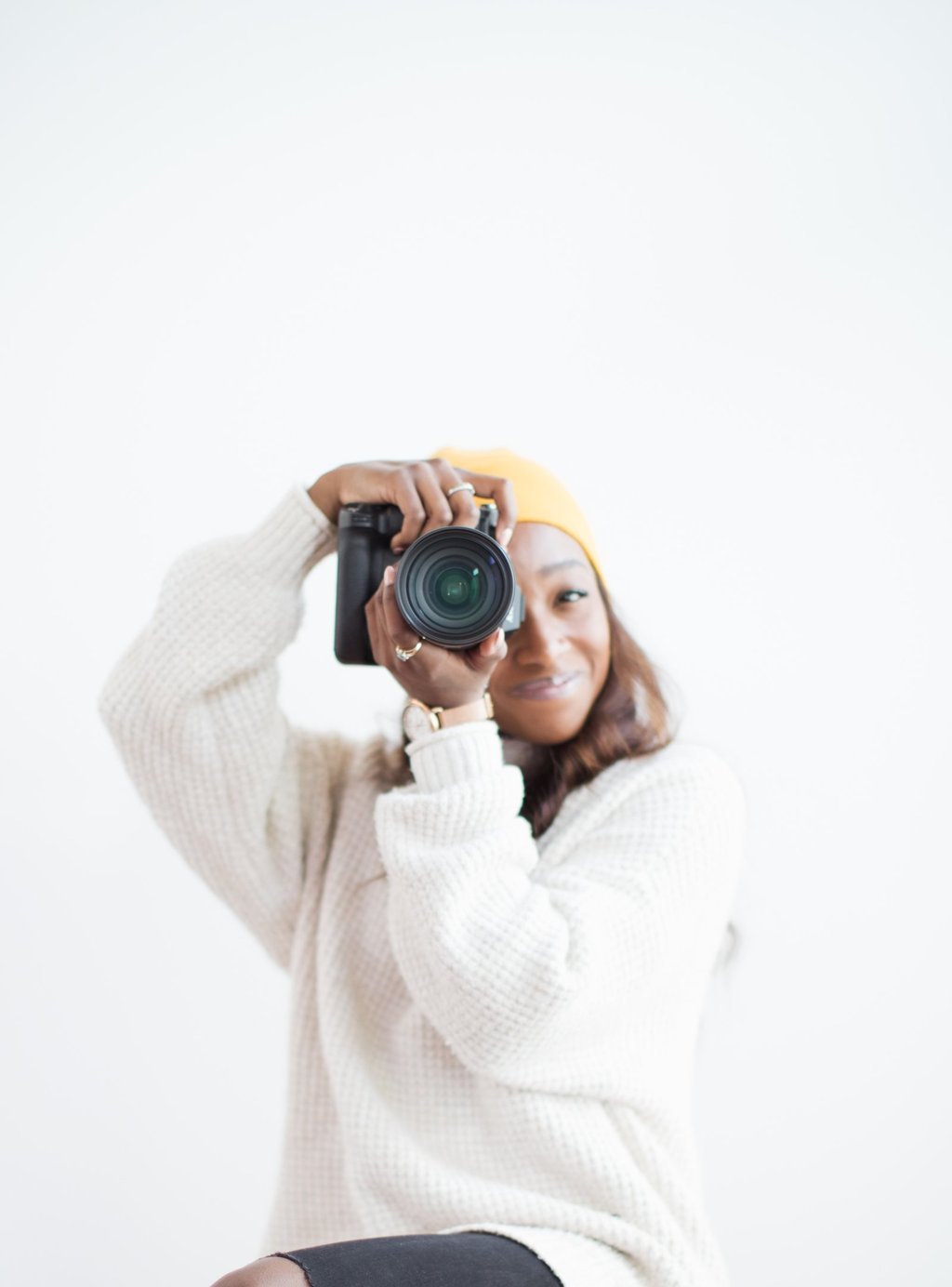 Portrait of Shade holding a camera