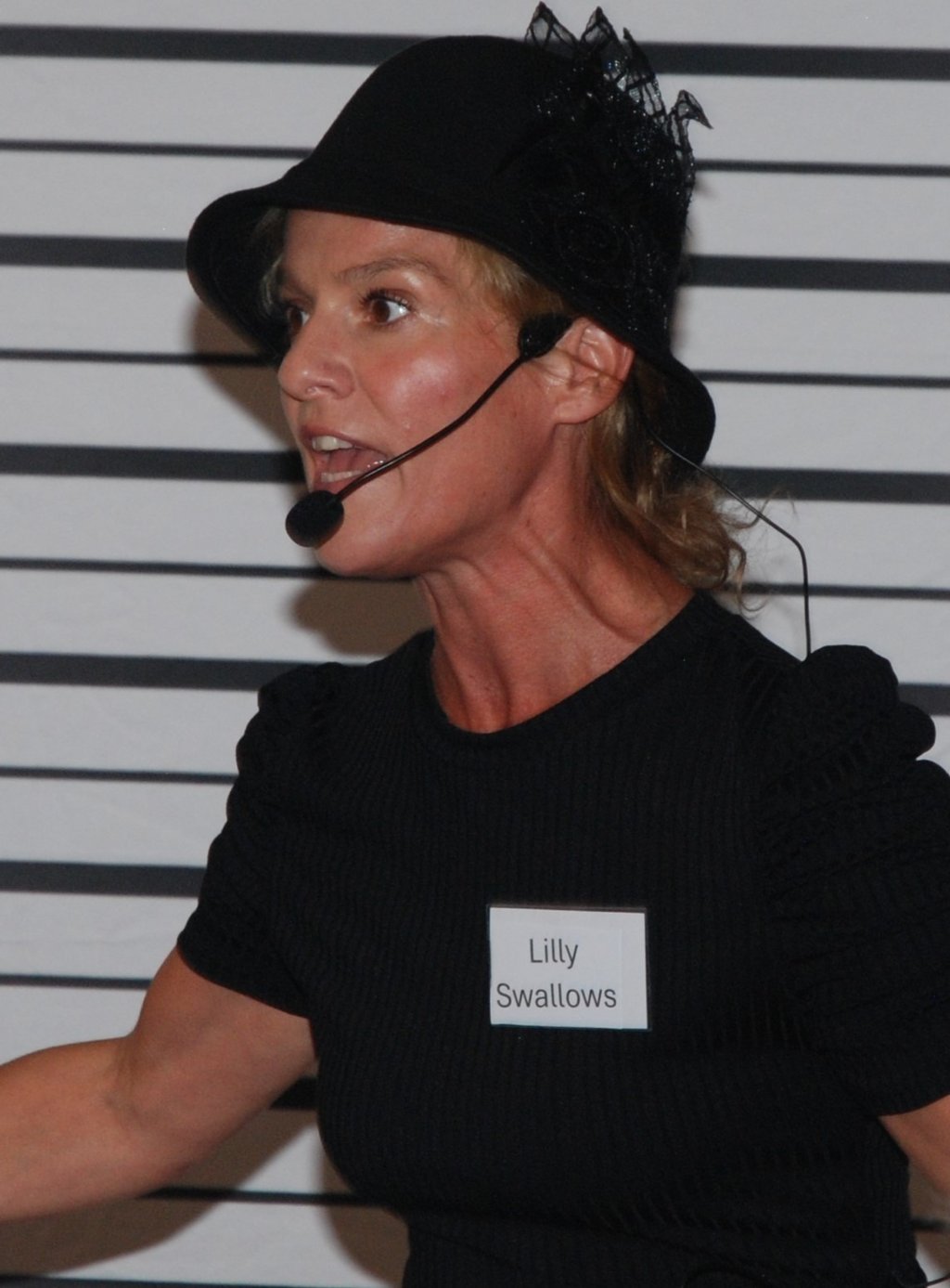 a woman in a black hat and a black hat