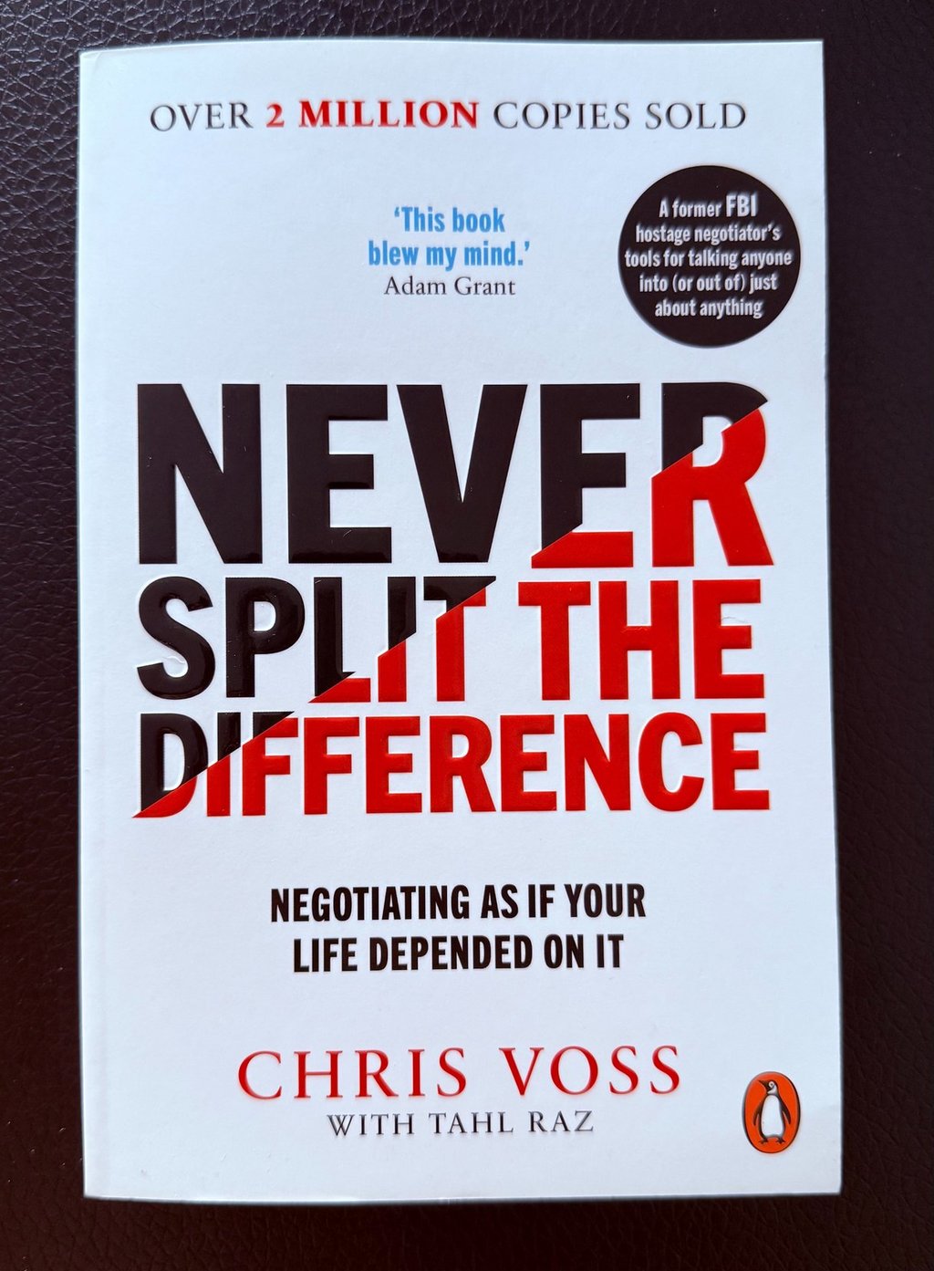 a book cover of Never split the difference