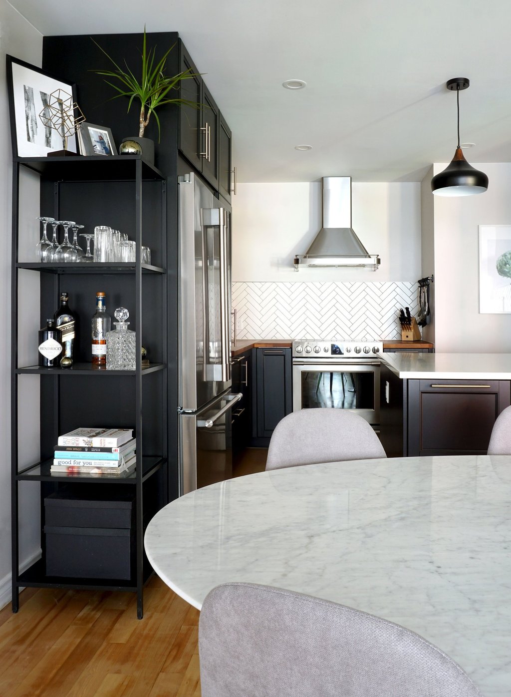 a kitchen with a marble table and chairs