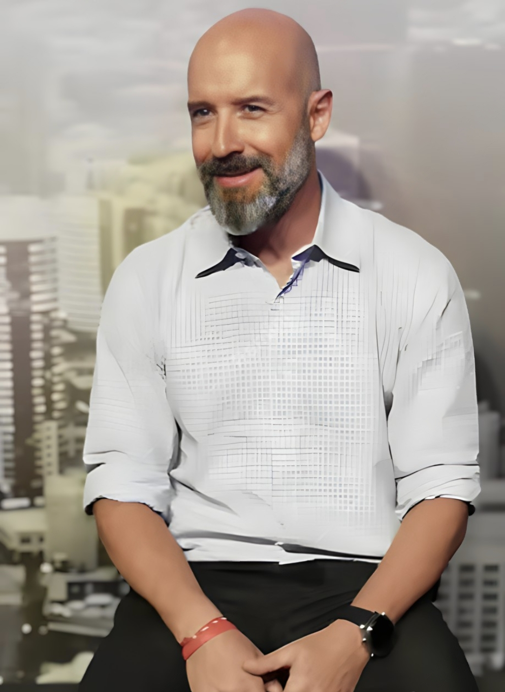 a bald balding man with a beard and a white shirt martin pe coach