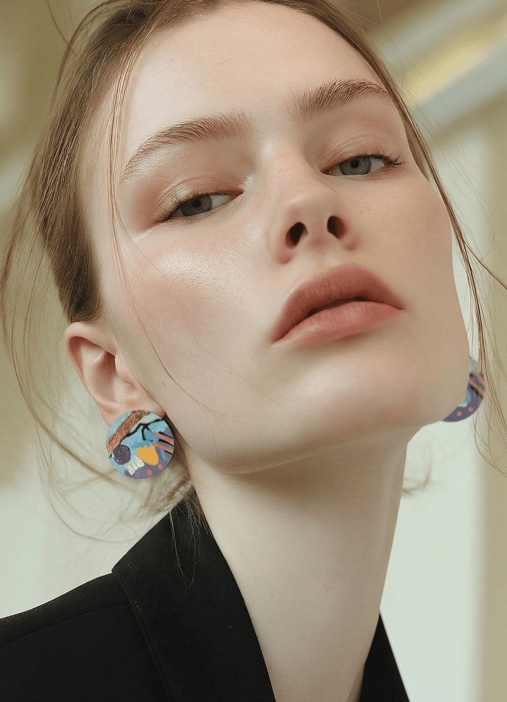 Model wearing hand painted earrings