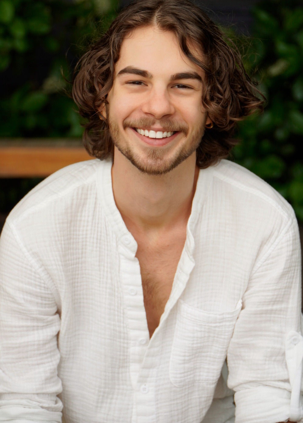 a man with a beard and a white shirt