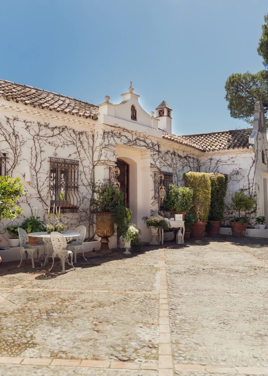 Andalusian courtyard with arched entrance and stone paving