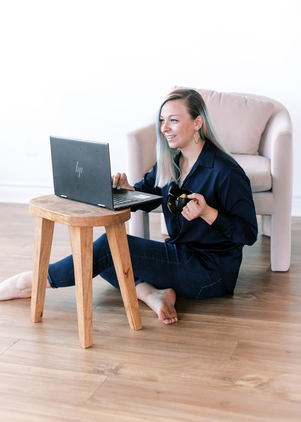 Tabitha with butterfly effect consulting on her laptop talking to a client