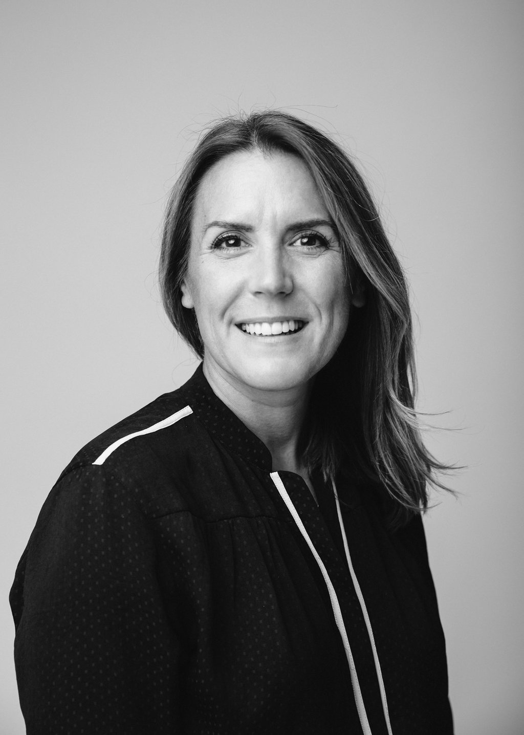 Black and white headshot of a white, middle aged women who is a counsellor