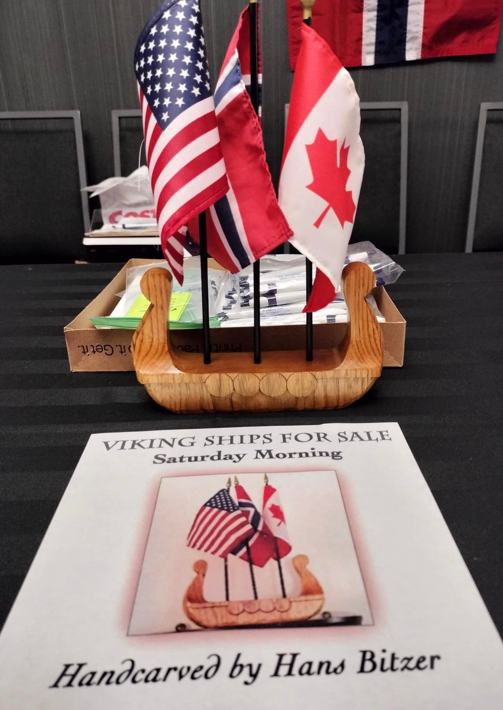 viking ship centerpiece with American, Canadian and Norwegian flags