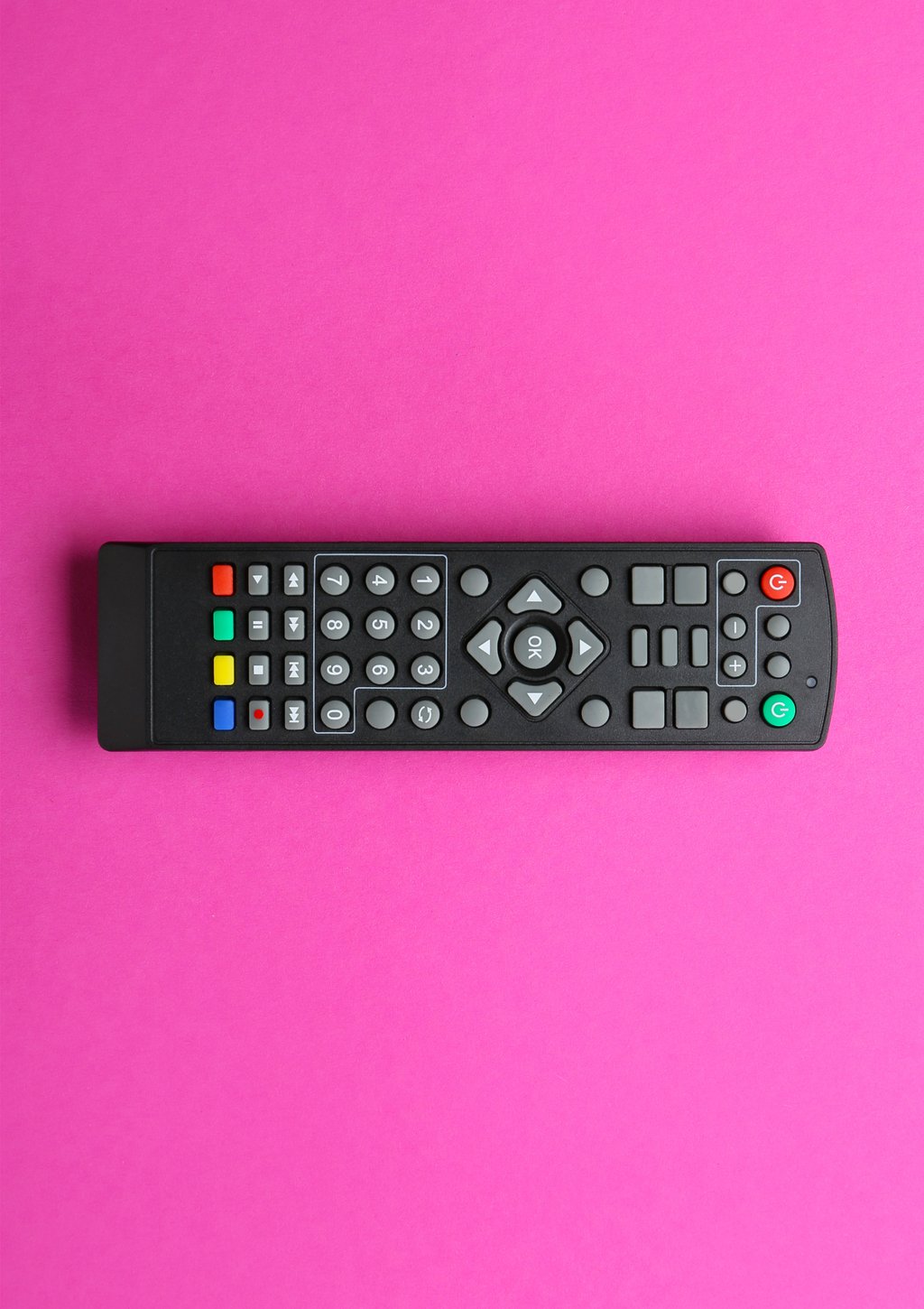 Pink background featuring a television remote control in the center.