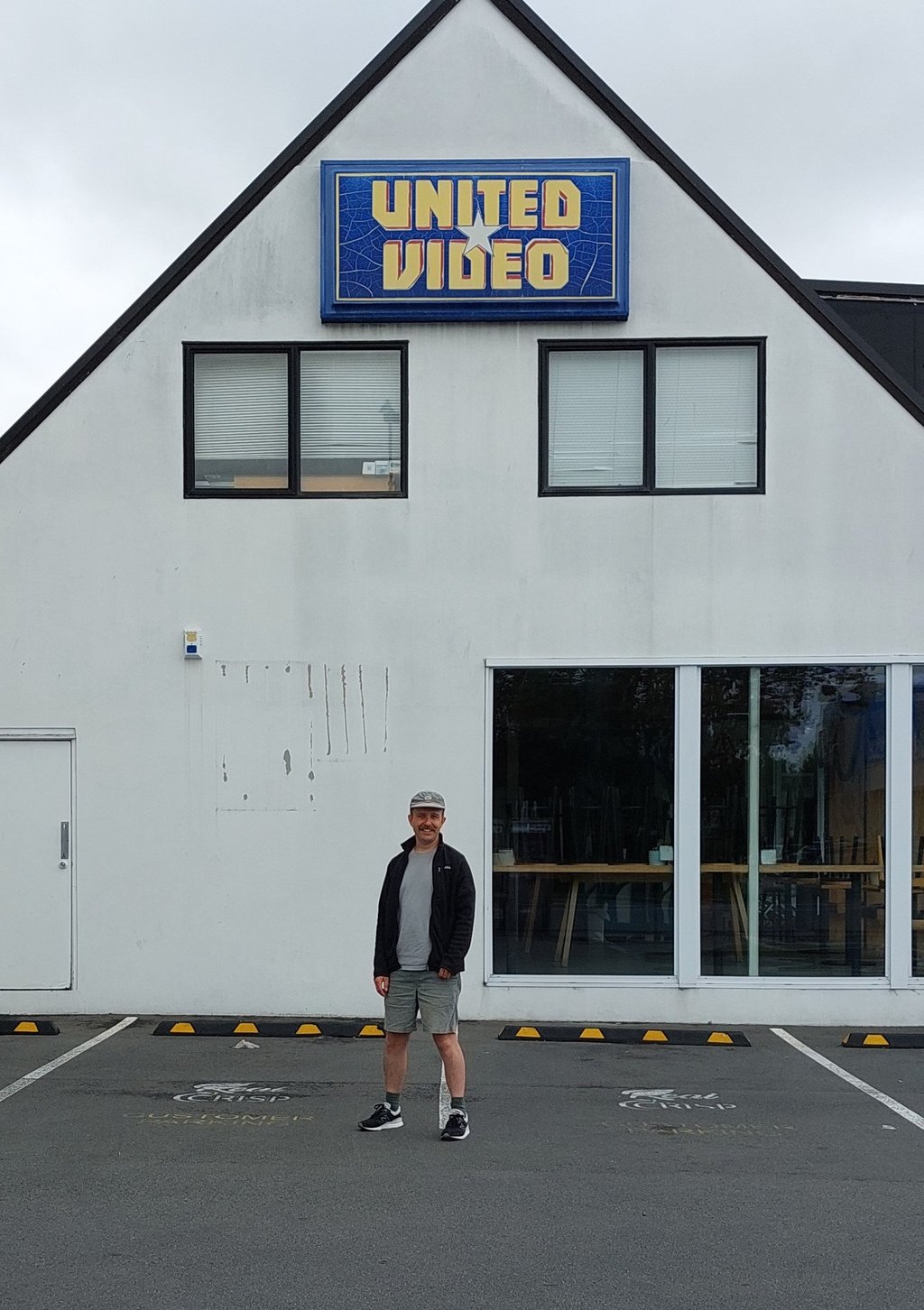 Jayden Elley below an old United Video sign