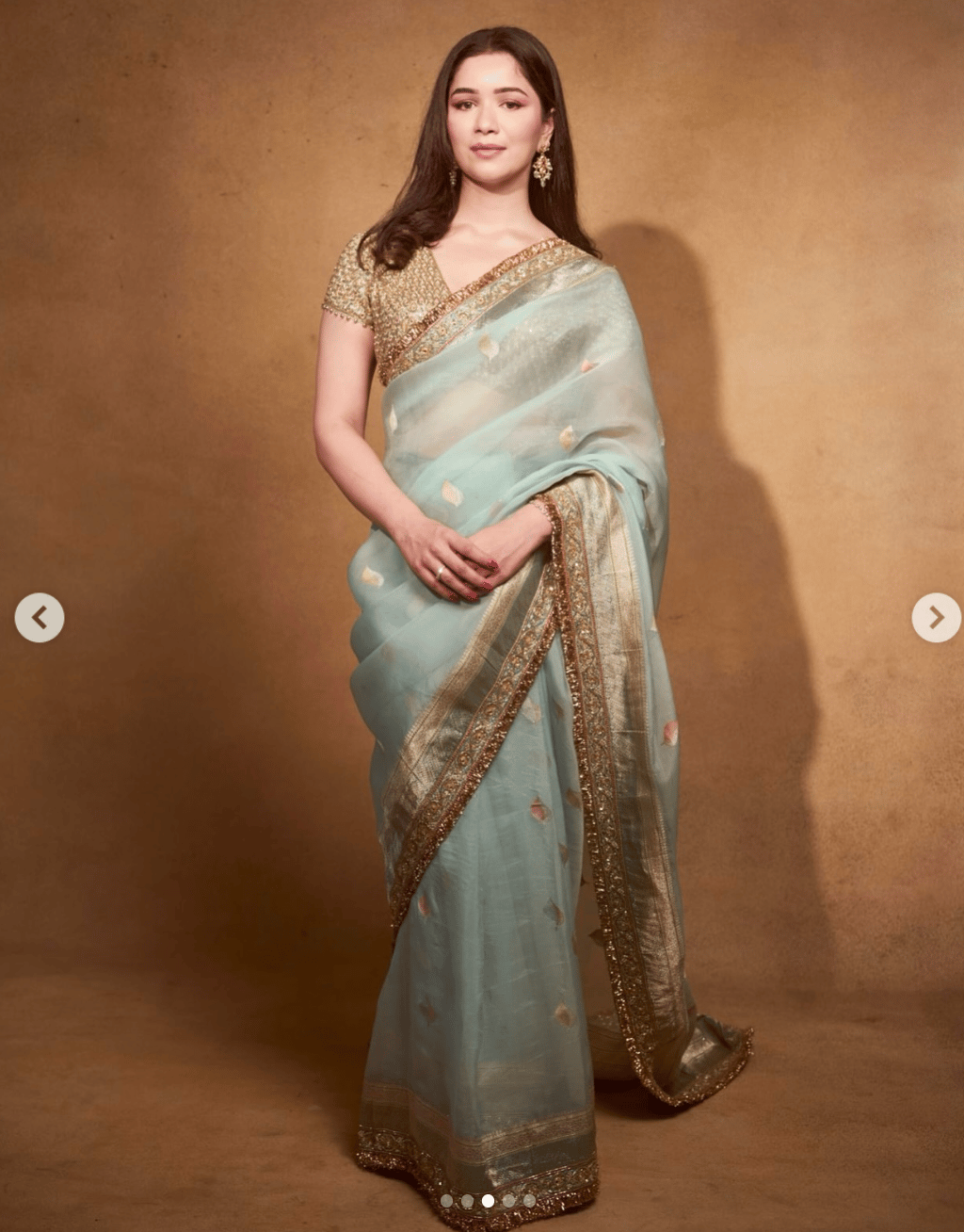 Sara Tendulkar wearing a light mint green saree with a rich golden border, styled with a gold blouse and traditional earrings