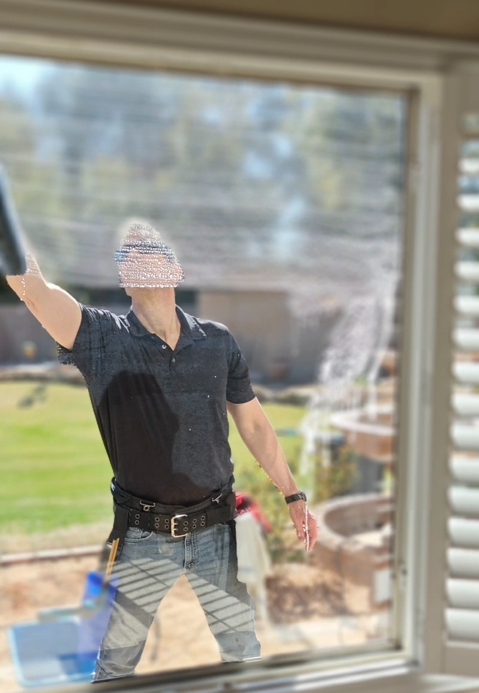 man washing a home window