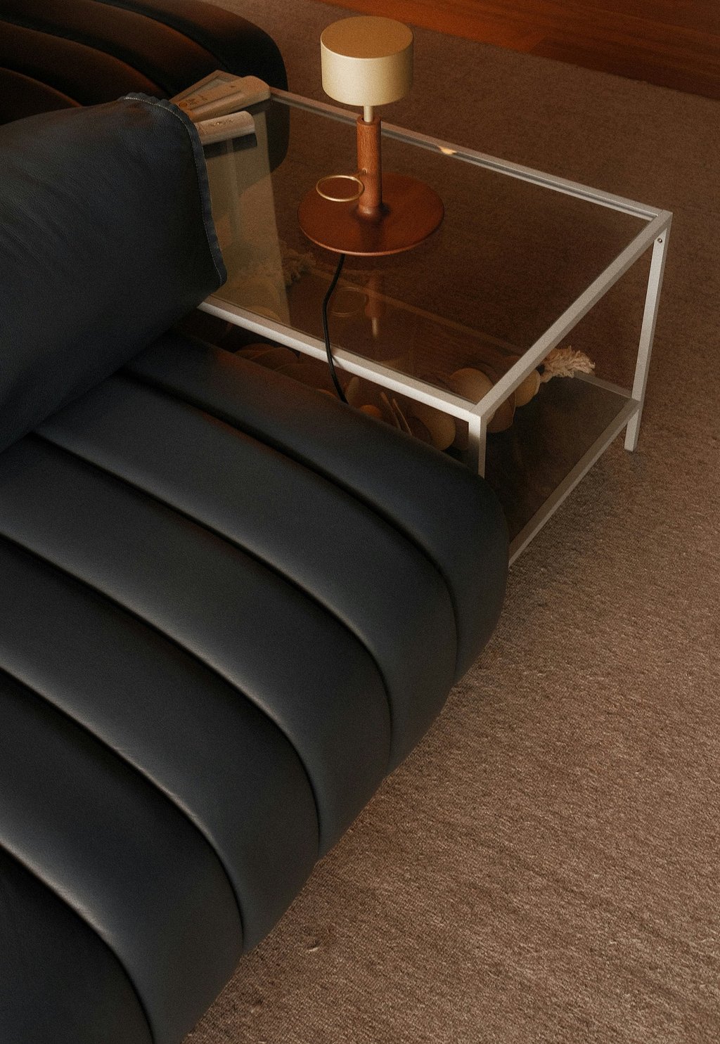 Elegant side table styling with glass top and warm ambient lighting