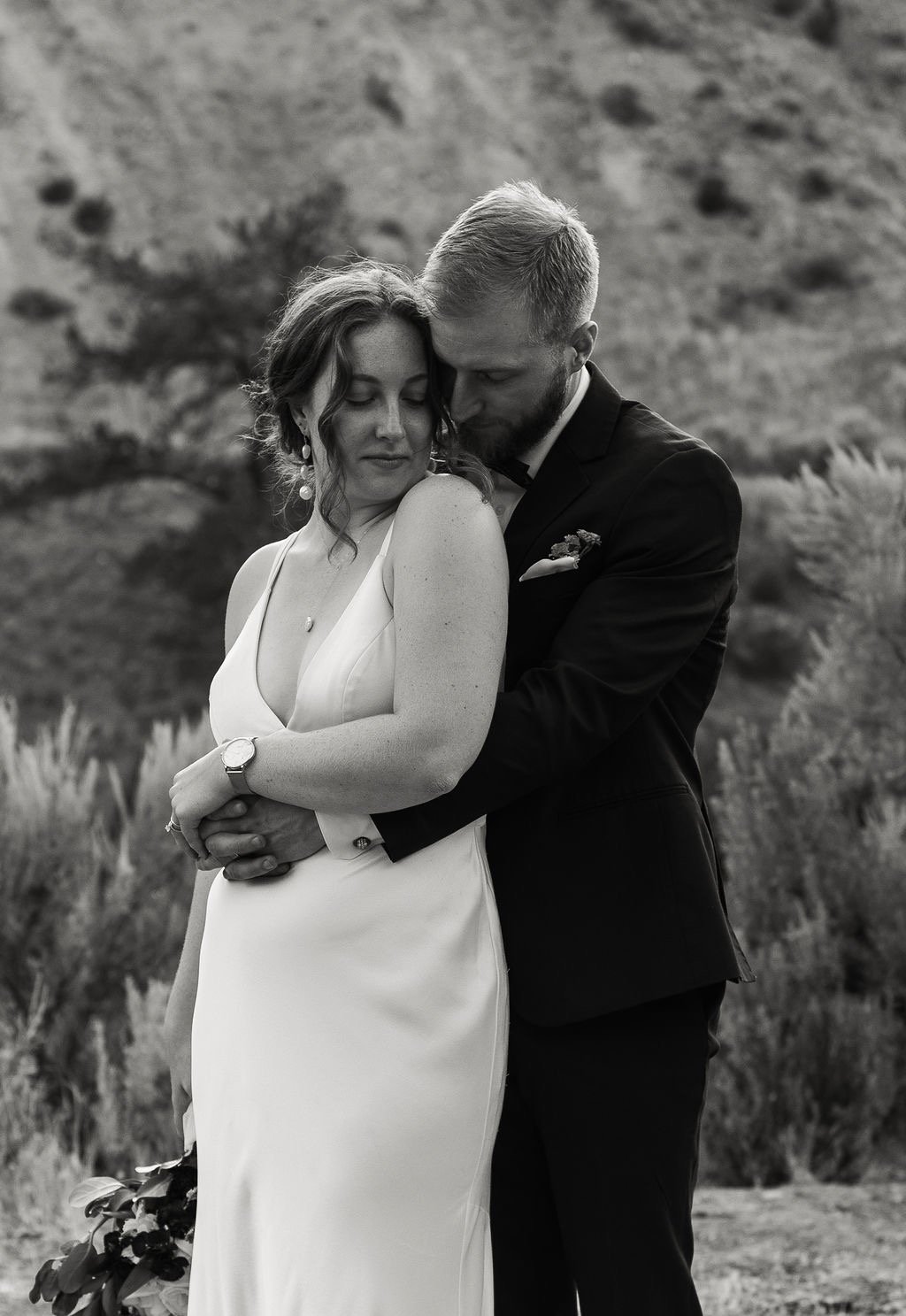 a bride and groom embracing