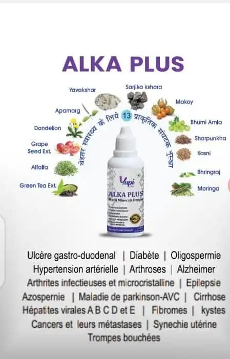 a person holding a bottle of alka plus