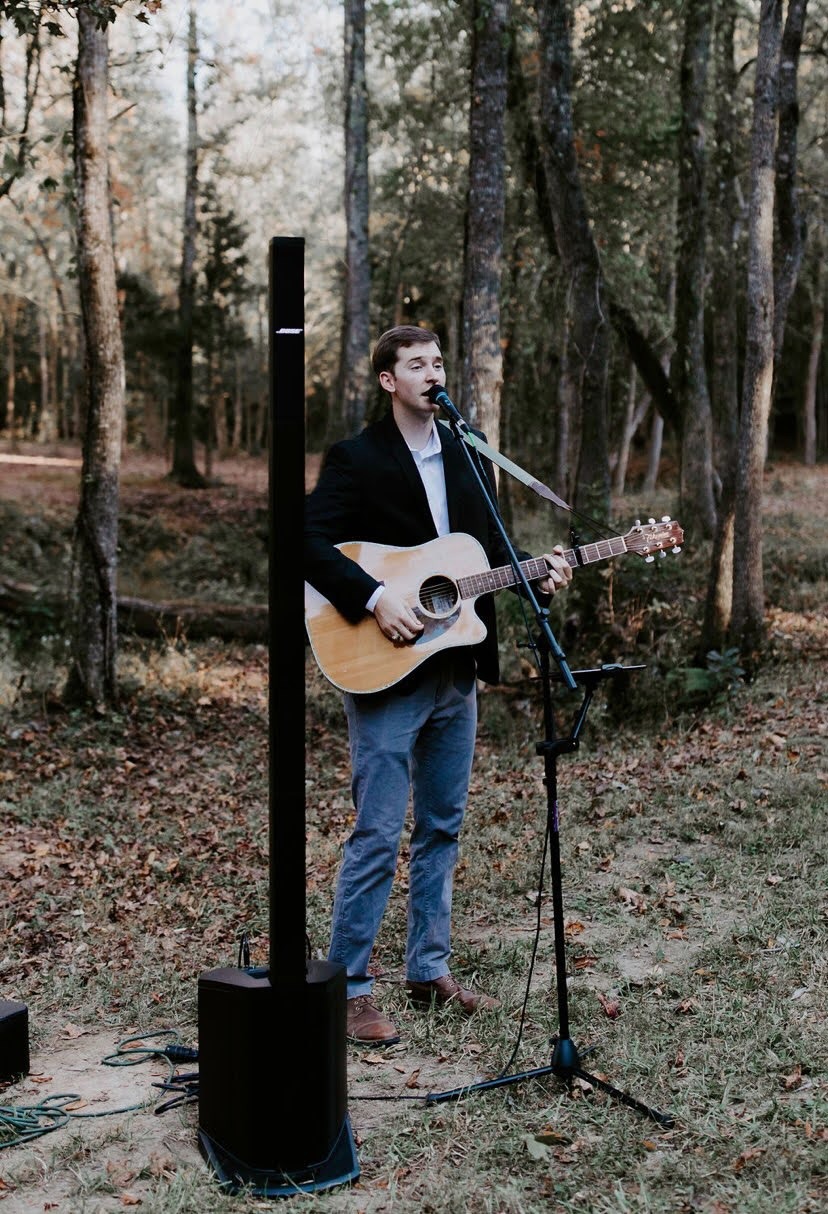 Reagan performing for an outdoor wedding ceremony