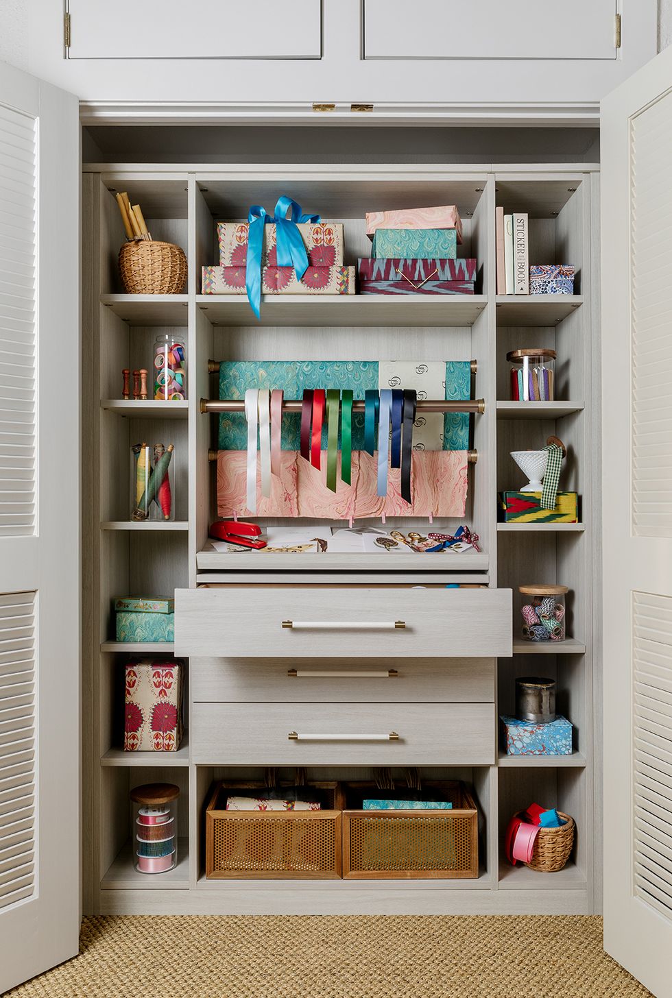 a closet with a shelf full of books and a toy
