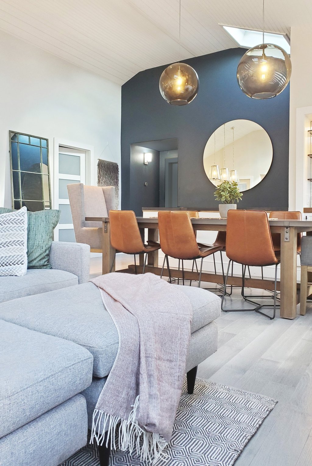 Open plan living dining, teal accent wall, globe pendants, cathedral ceiling, Medford MA, Erica Fossati Design