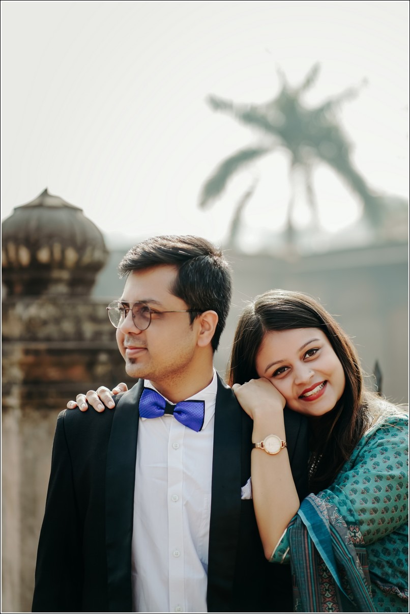 Pre wedding photo of a couple in a garden, capturing their love story