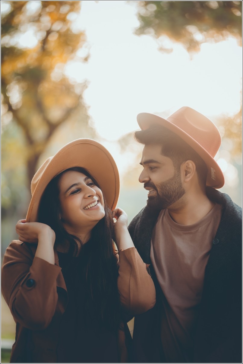 Elegant pre wedding photo of a couple embracing by the lake