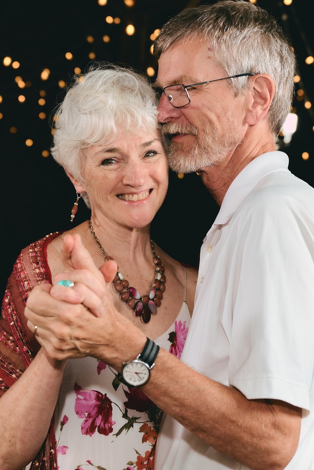 a man and woman dancing at a wedding party