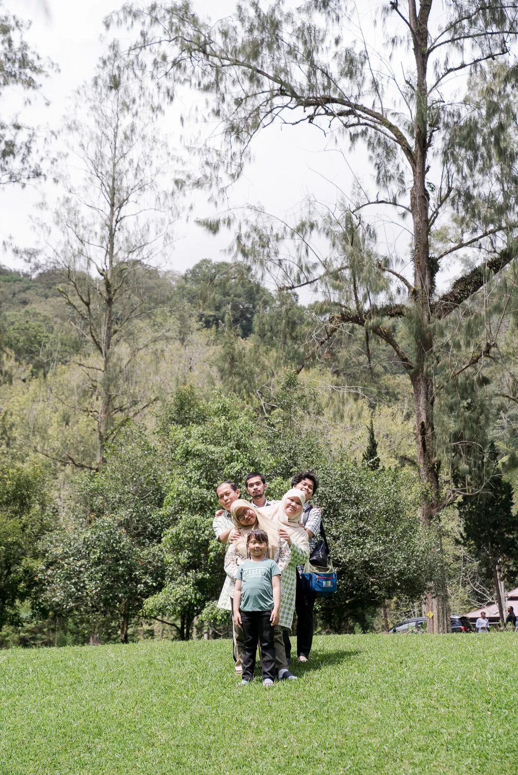 Natural family walk captured at Botanical Garden Bedugul Bali during an outdoor family session.