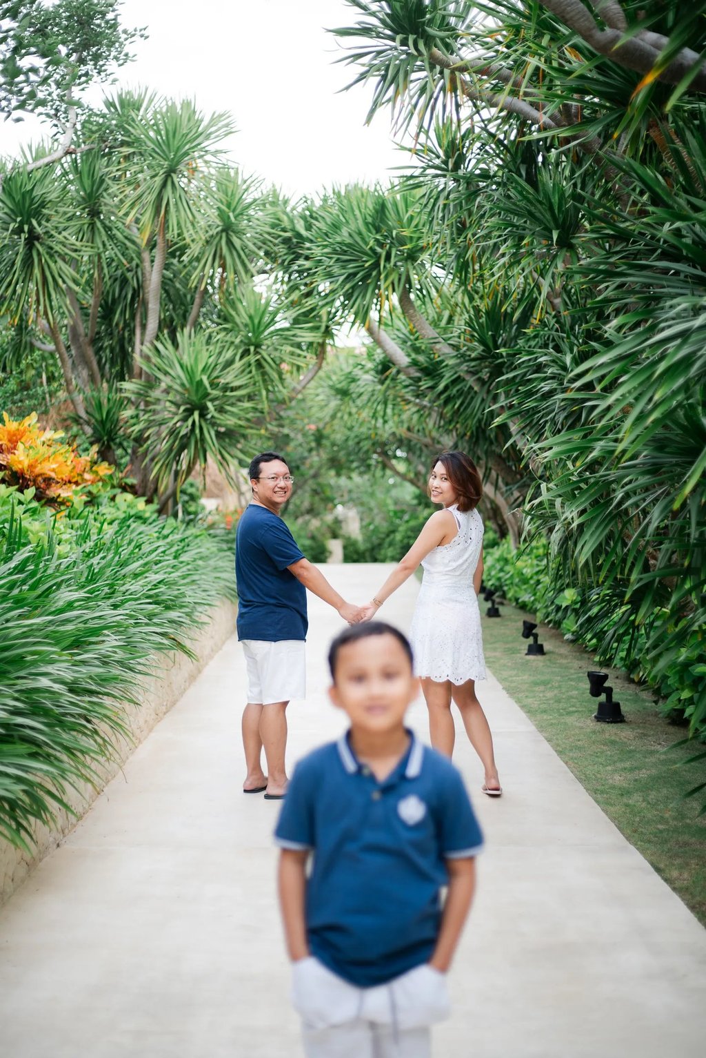Child portrait with parents in background at The Mulia Nusa Dua Bali