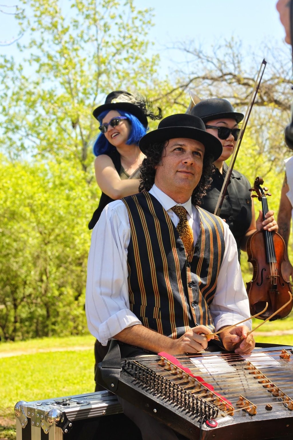 Band member playing tsimbl during a live performance with Mazel Tov Kocktail Hour