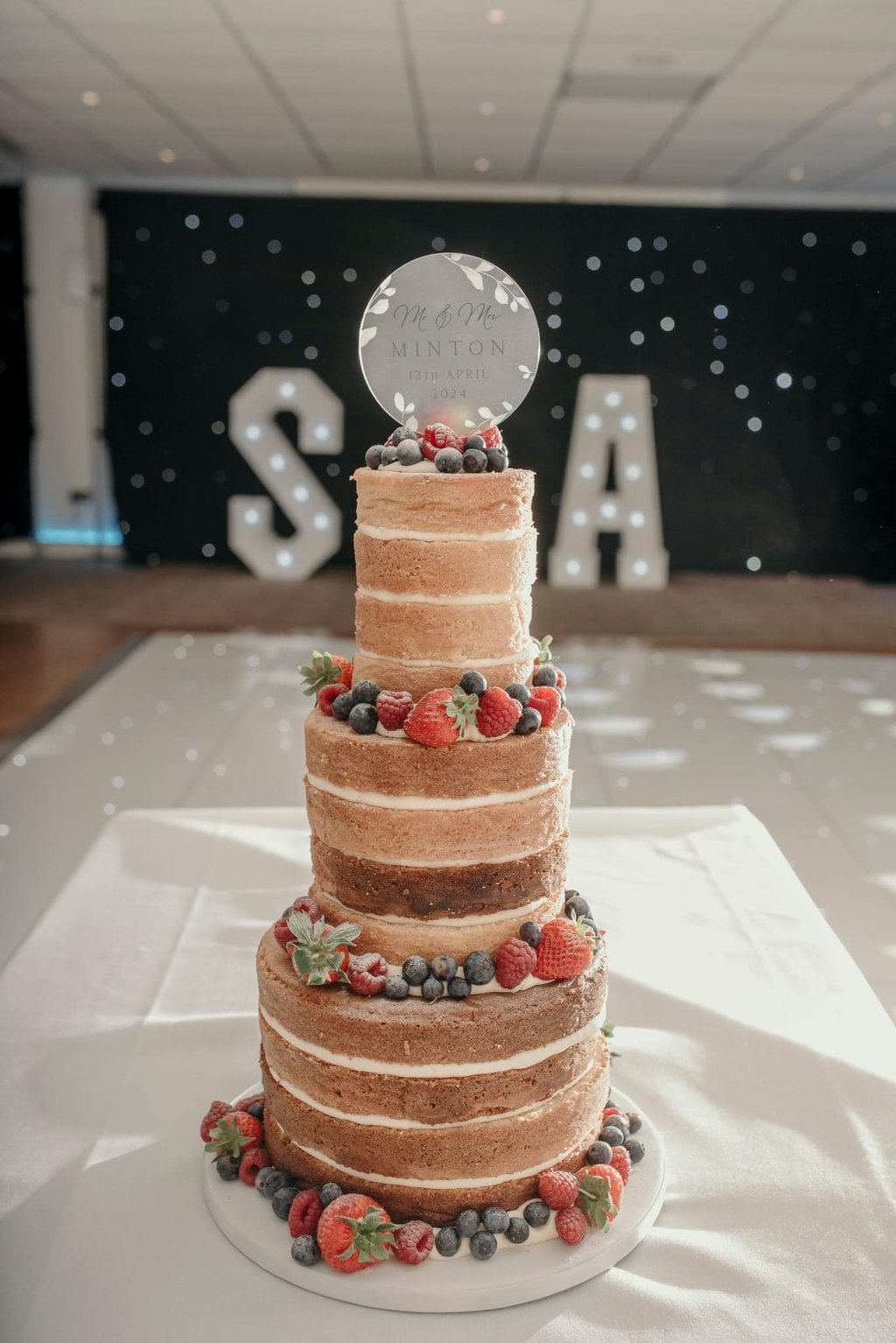 Naked 3 Tier Wedding Cake with Fresh Berries by Sweetcupcakes Cakery