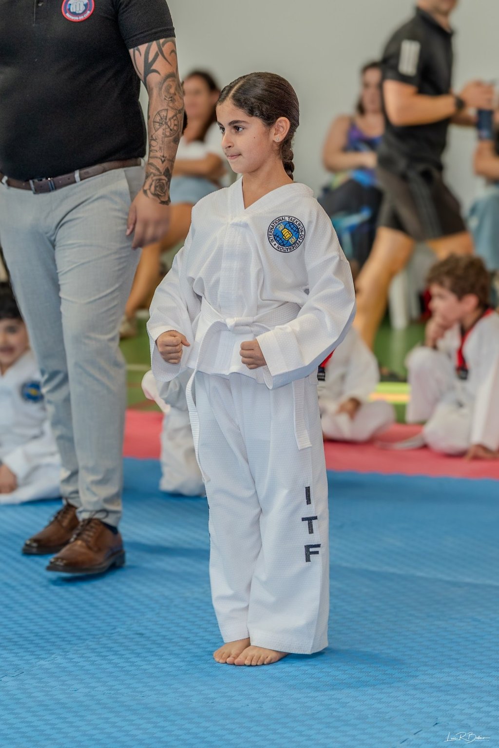 Hwa Rang white belt student enjoying kids taekwondo classes in Dubai