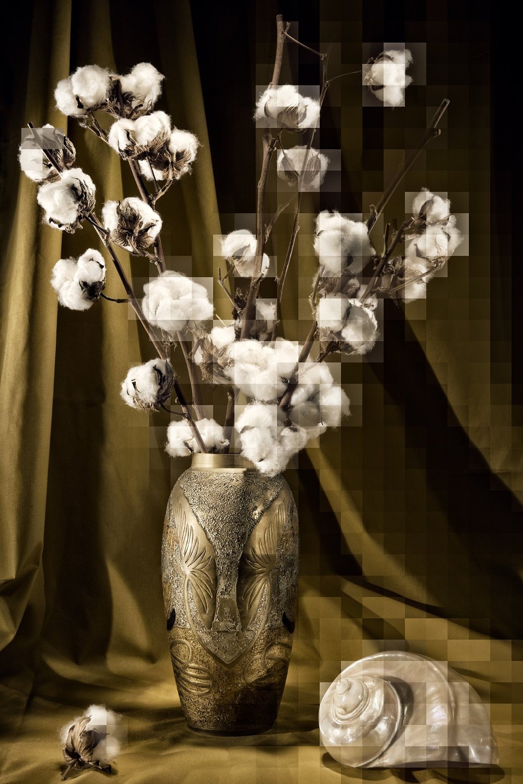a vase with cotton flowers in a vase