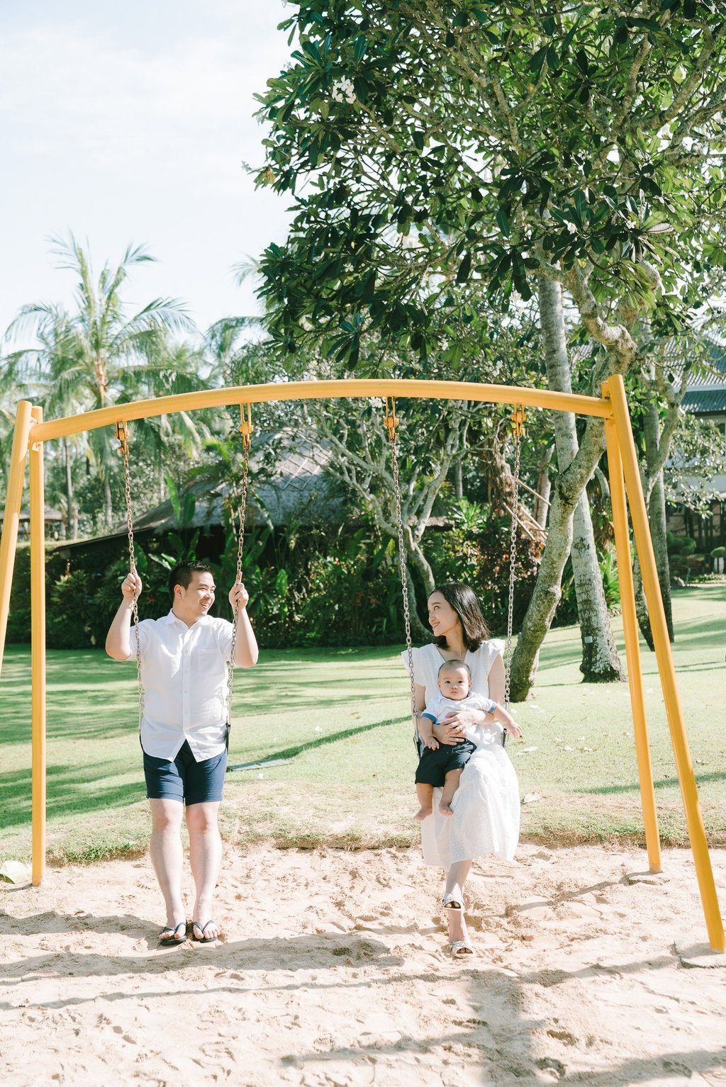 Family playing at resort playground in Intercontinental Jimbaran captured in a candid and joyful family photography session