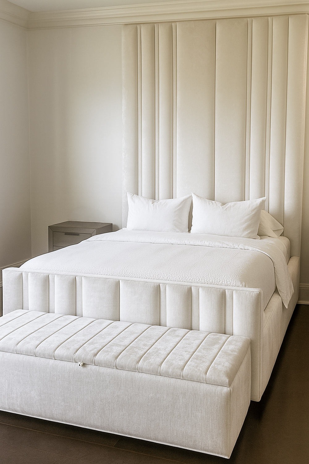 Bedroom with vertical upholstered wall panels in a soft neutral tone by Solo Home Decor