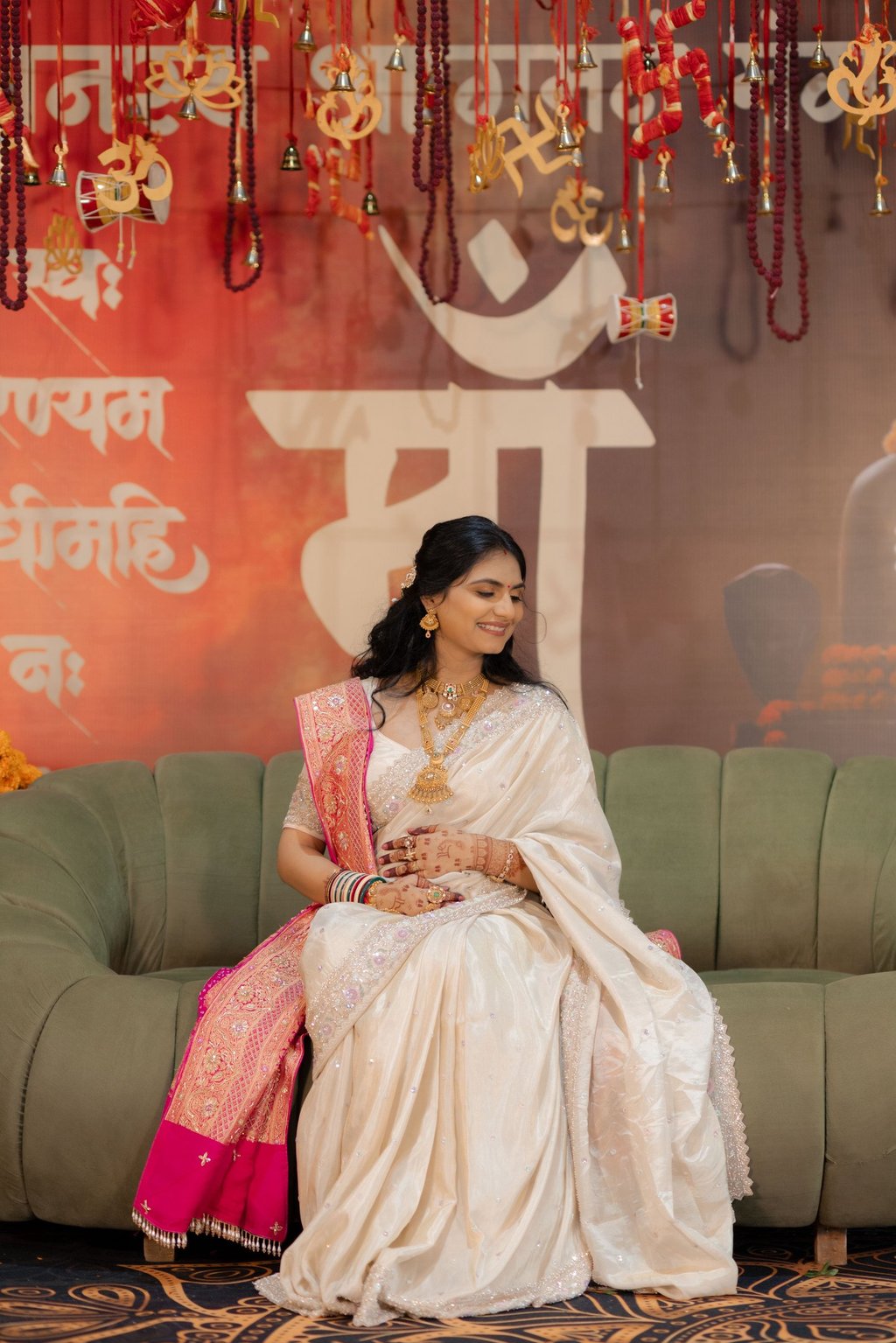 Closeup of a radiant bride's makeup being perfected by R&D Bridal Studio artist for her baby shower