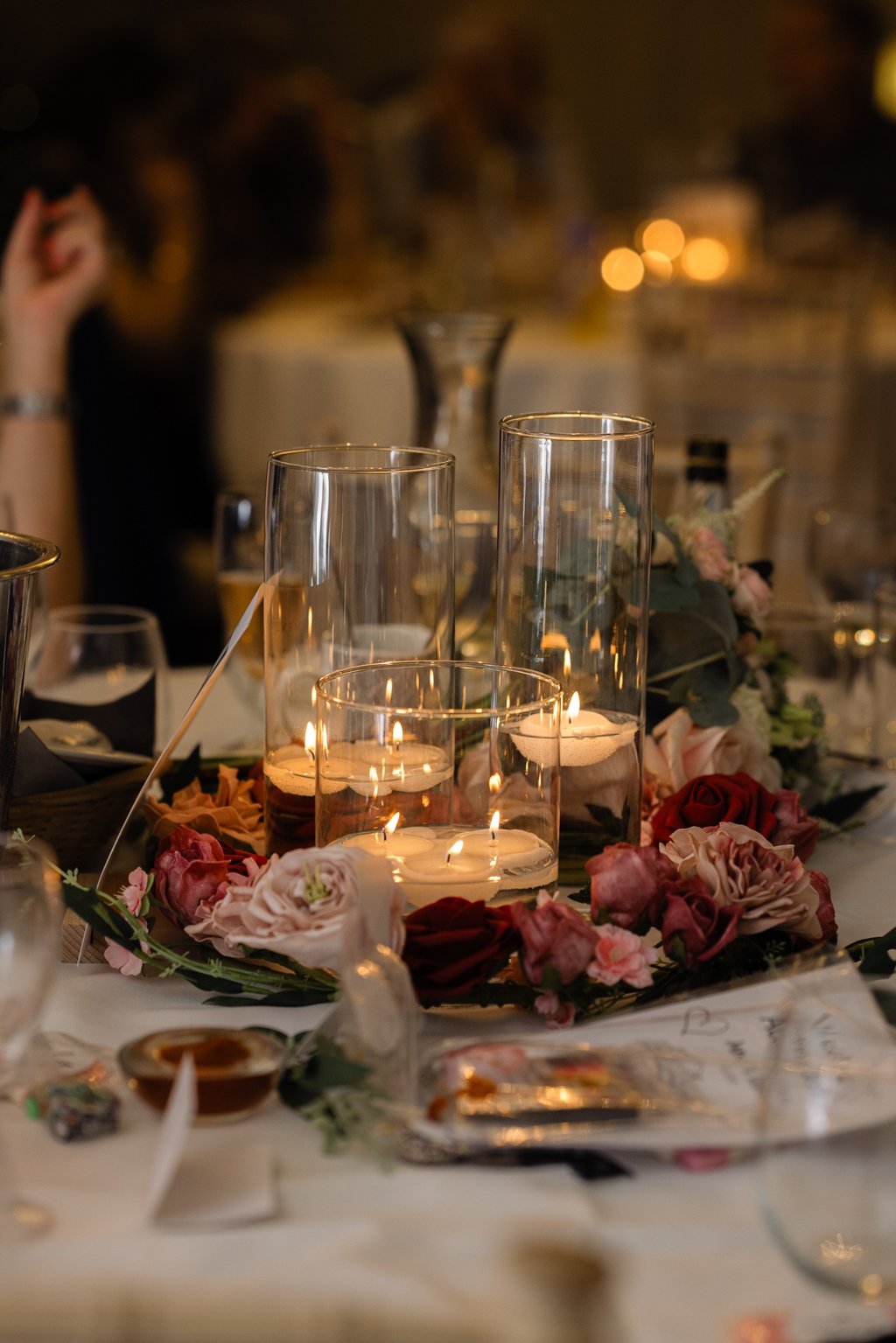 Candle and glass flower centrepieces at The Mill House Hotel