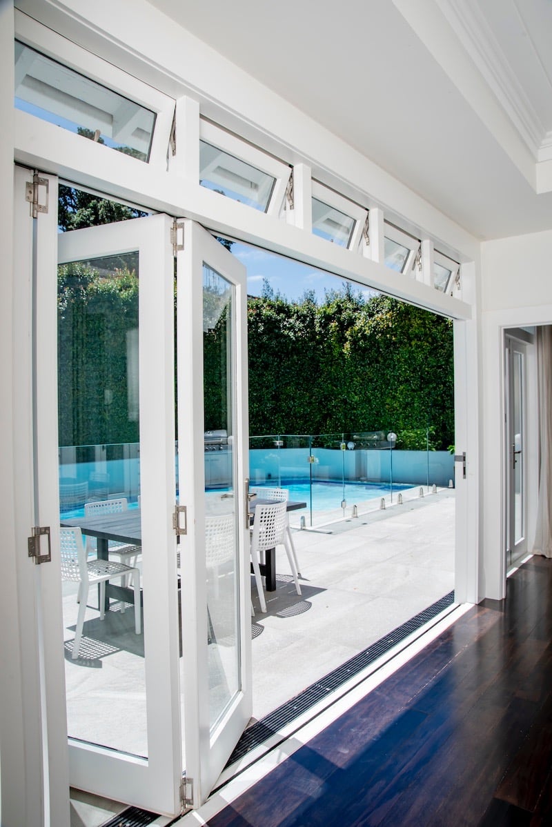 Stacker doors for indoor outdoor flow - Qualitas Builders