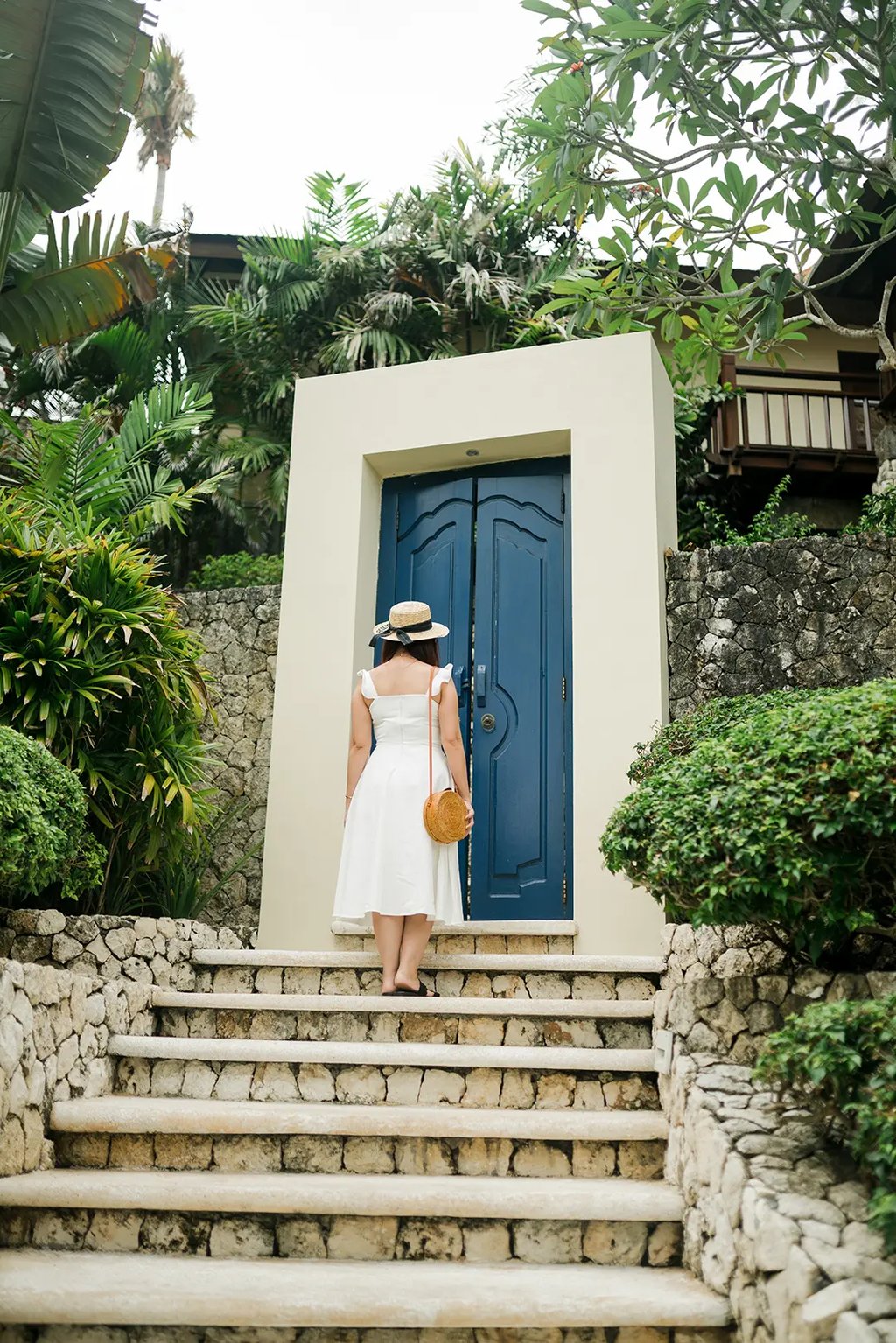 Selly standing near the tropical villa entrance at Karma Kandara Uluwatu Bali  