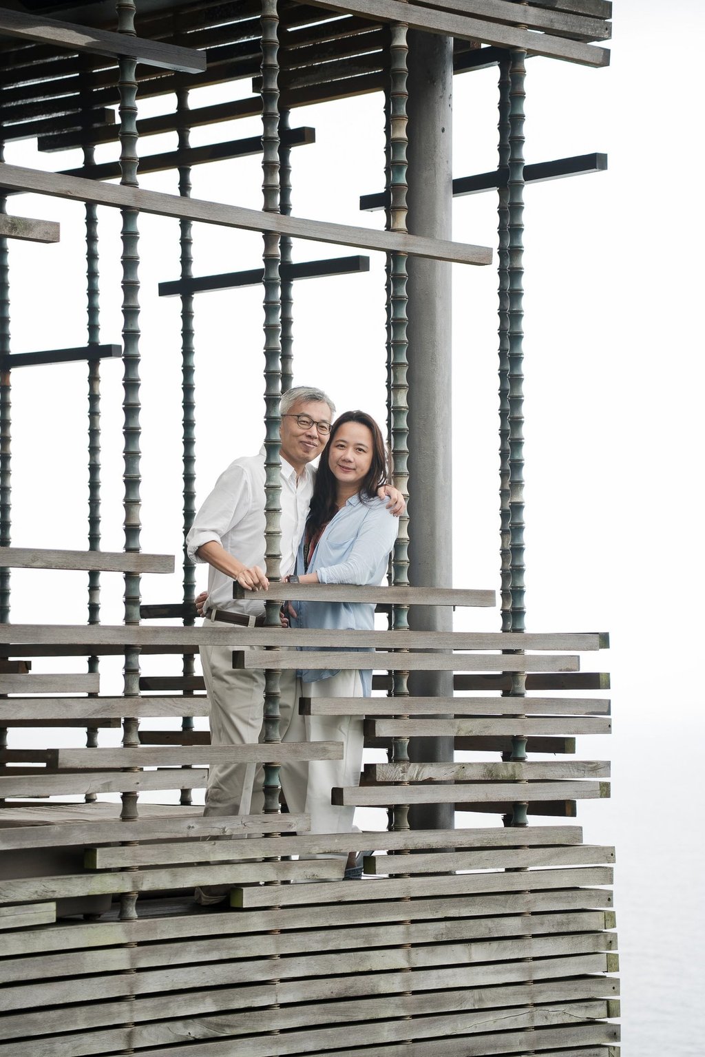 Mother and children framed within architectural lines at Alila Villas Uluwatu Bali in a quiet and intimate moment  