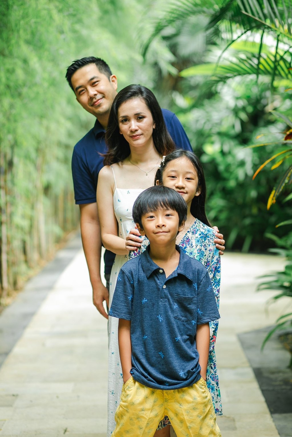 family portrait in tropical setting at Westin Nusa Dua Bali during natural photography session