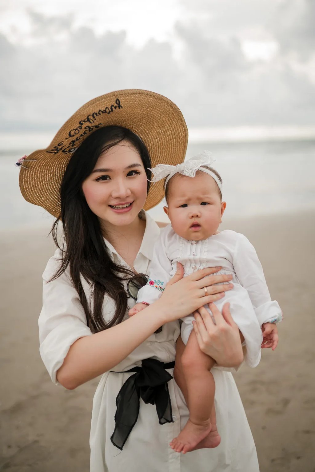 Mother and baby portrait at Seminyak Beach Bali captured in natural and timeless family photography style.
