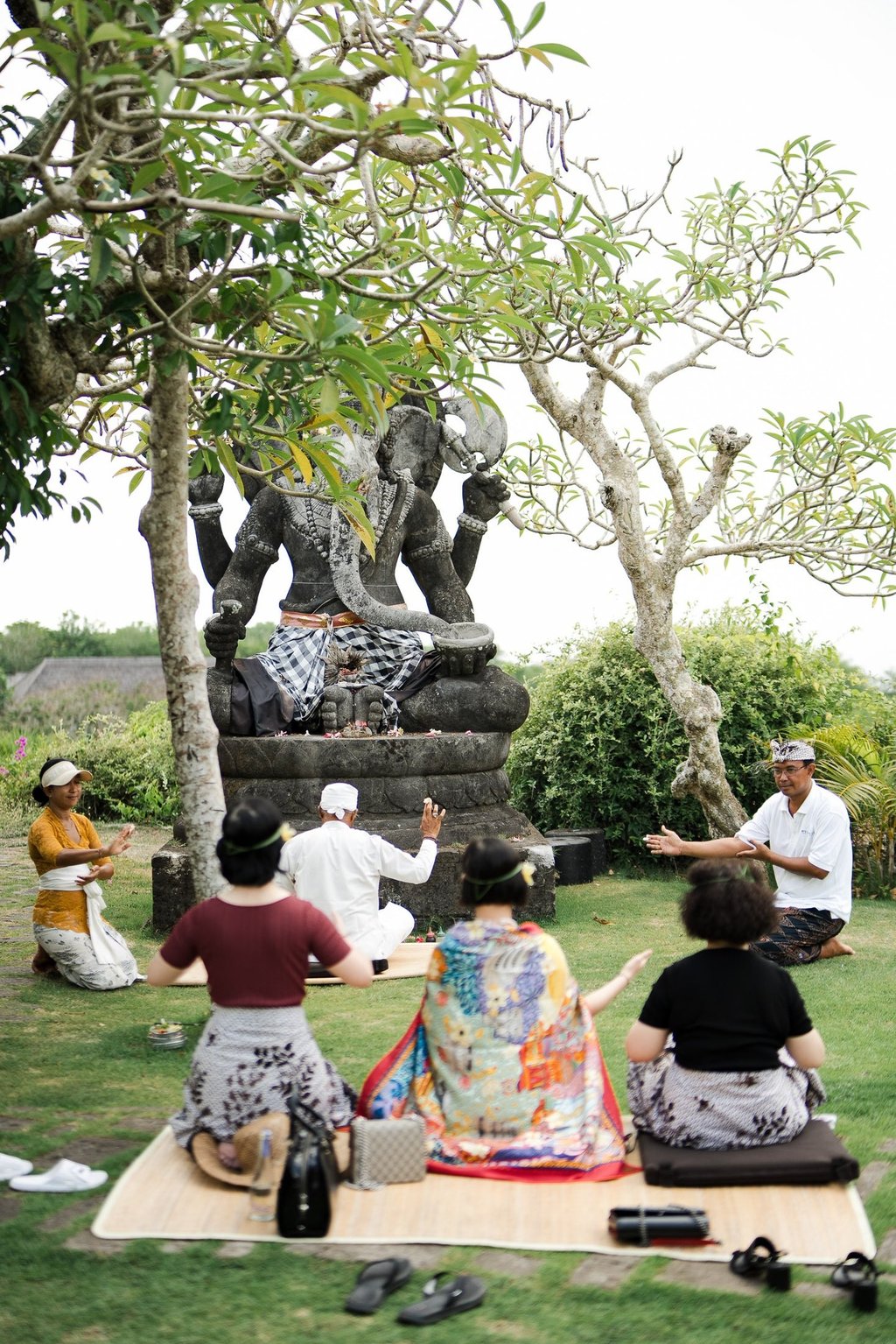 Zhang family participating in a traditional Balinese blessing ceremony at Bvlgari Resort Uluwatu Bali