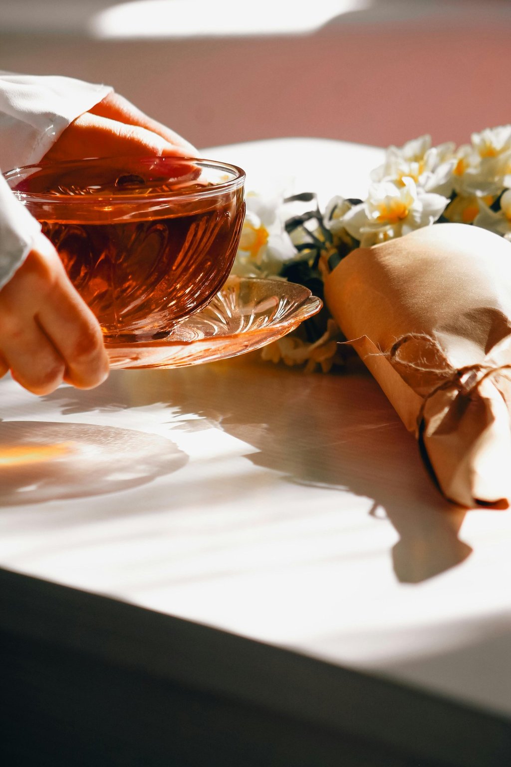 hands holding a cup of tea