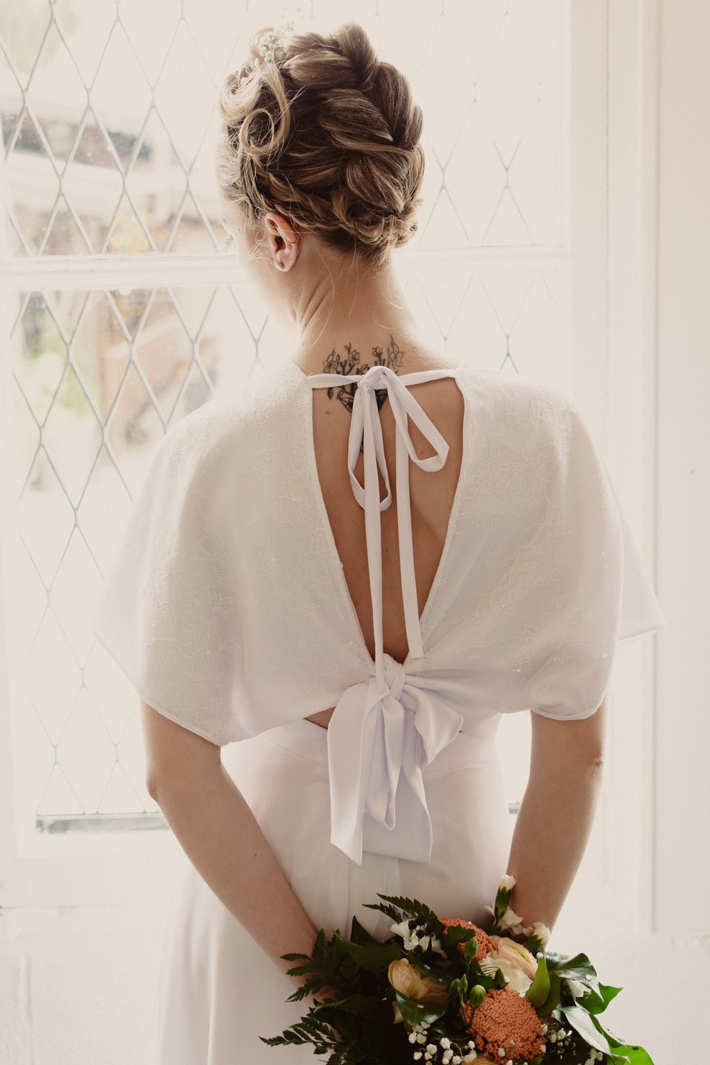 a woman in a white dress with a white dress