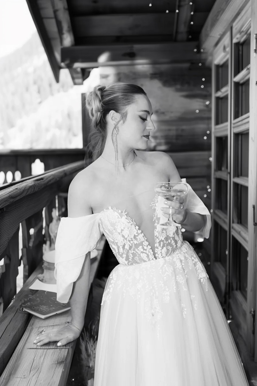 a woman in a wedding dress standing on a balcony
